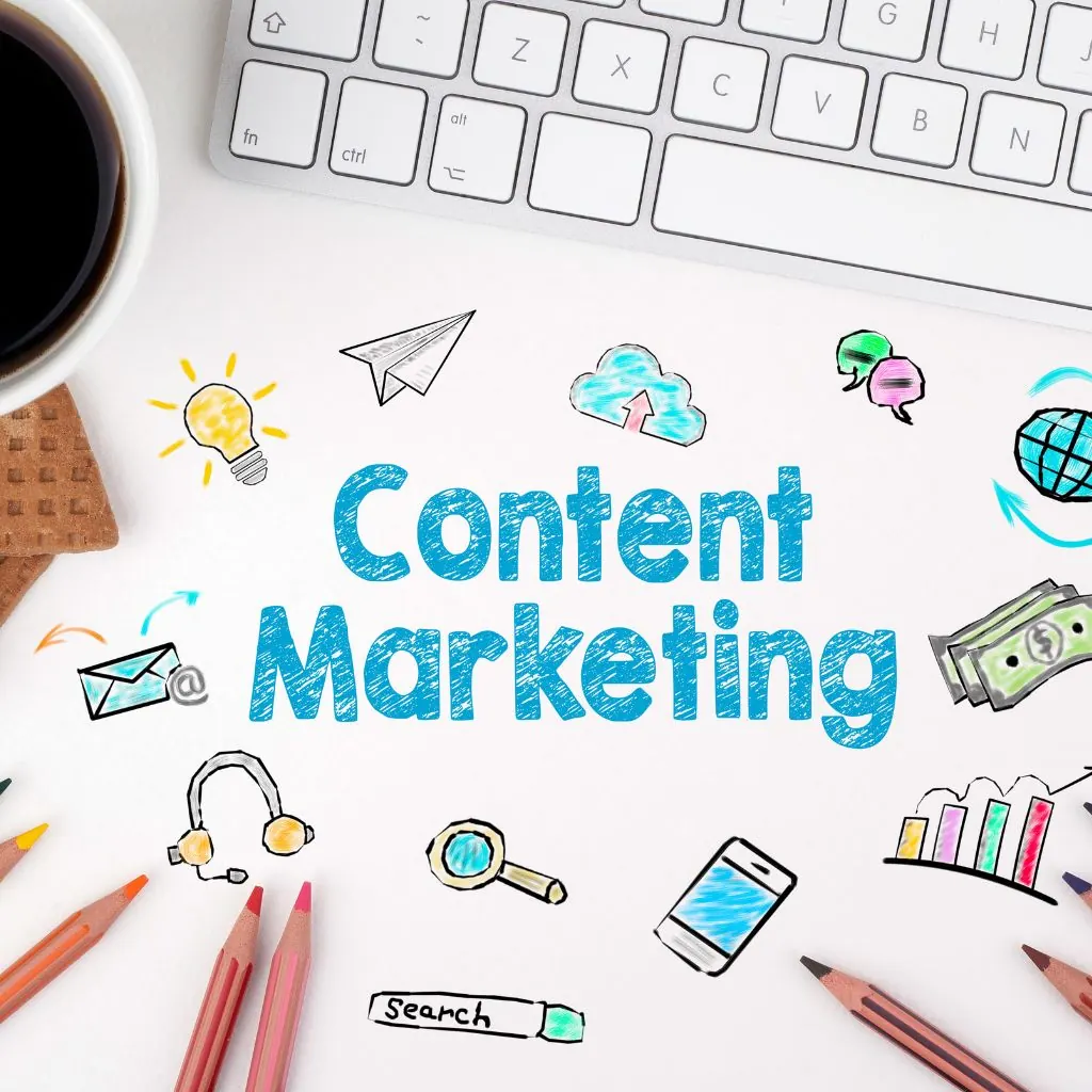 Hand-drawn content marketing doodles with pencils and a keyboard on a desk