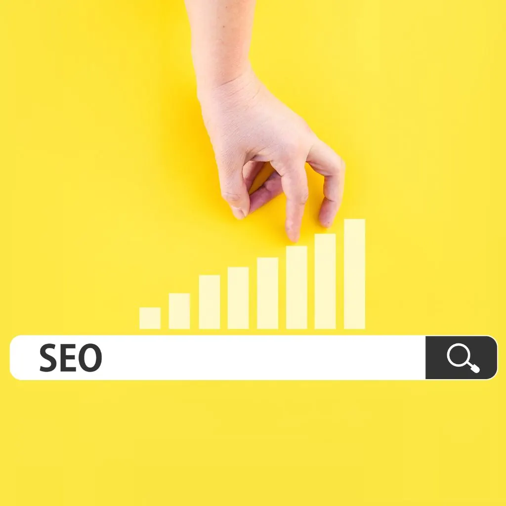 Hand placing a bar on a rising bar chart above an SEO search box